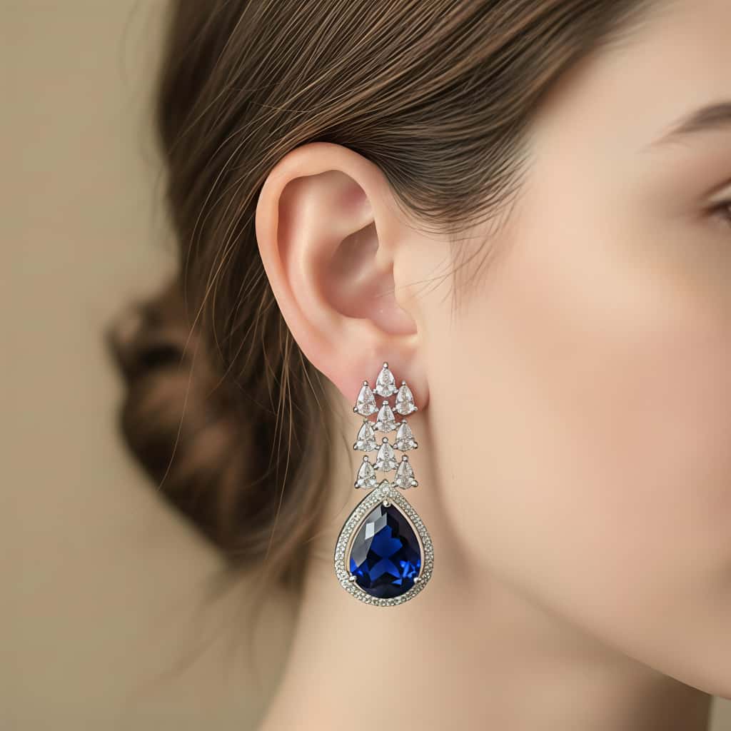 Blue stone silver drop earrings with AAA zirconia stones by Karat India
