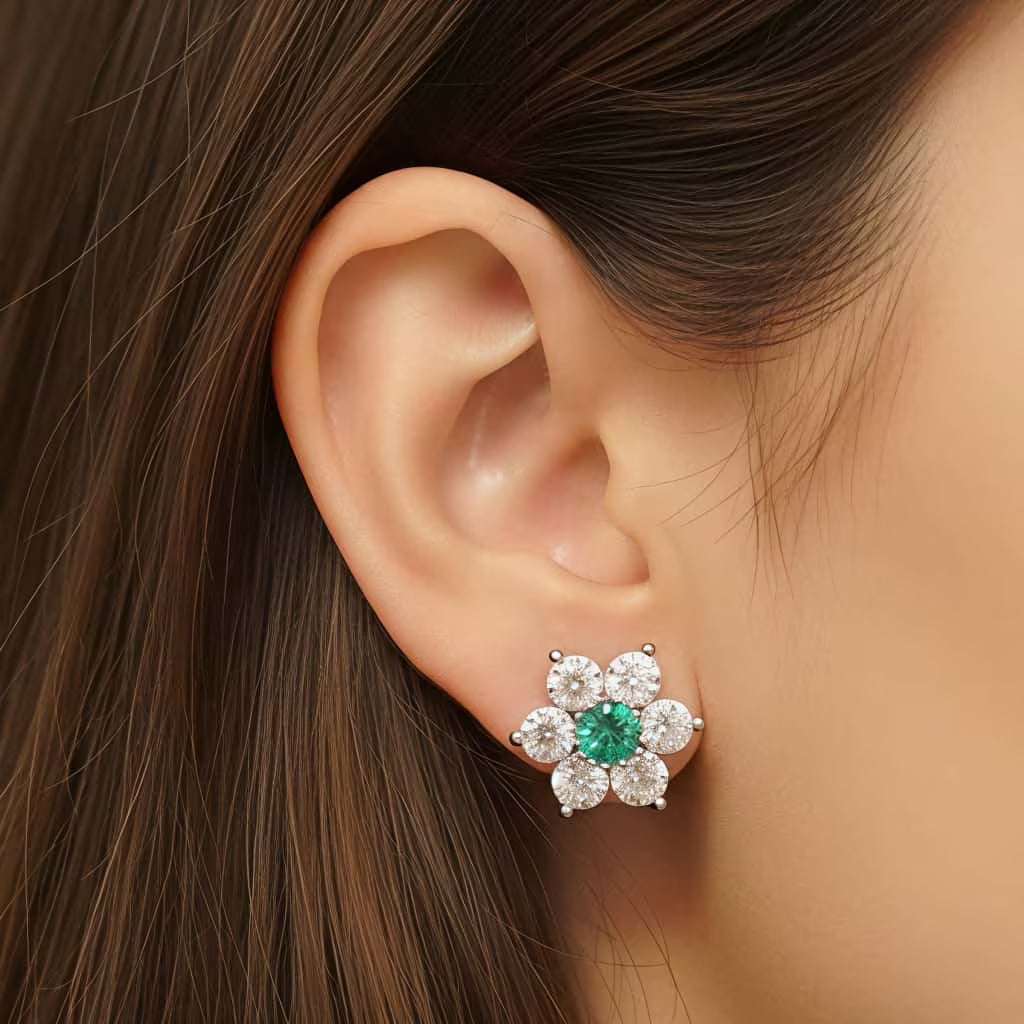 Emerald green floral stud earrings with white stones in silver finish