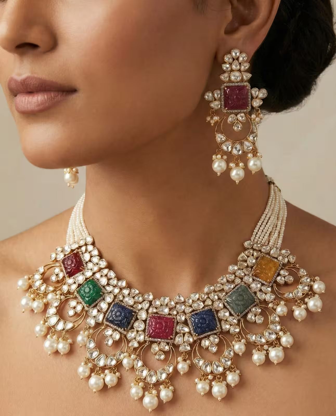 Multicolor Jadau necklace set with polki stones and pearl drops with matching earrings.