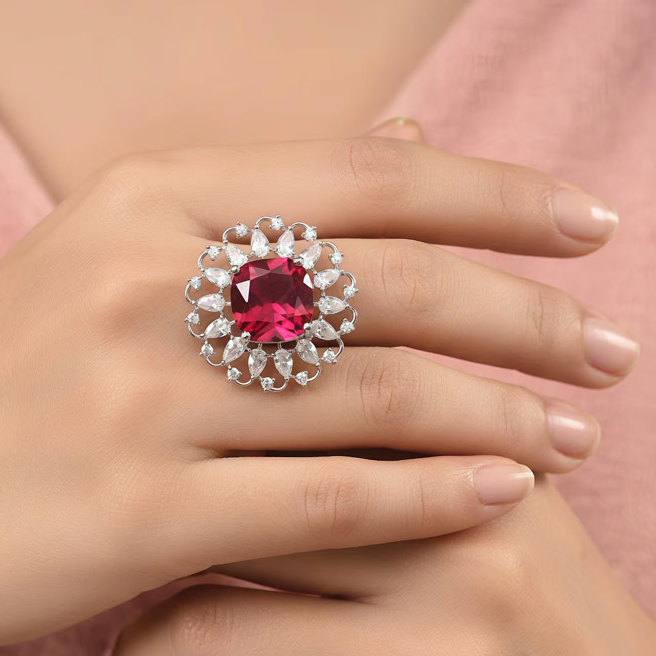 Ruby red cushion cut floral silver statement ring with white zircon halo design