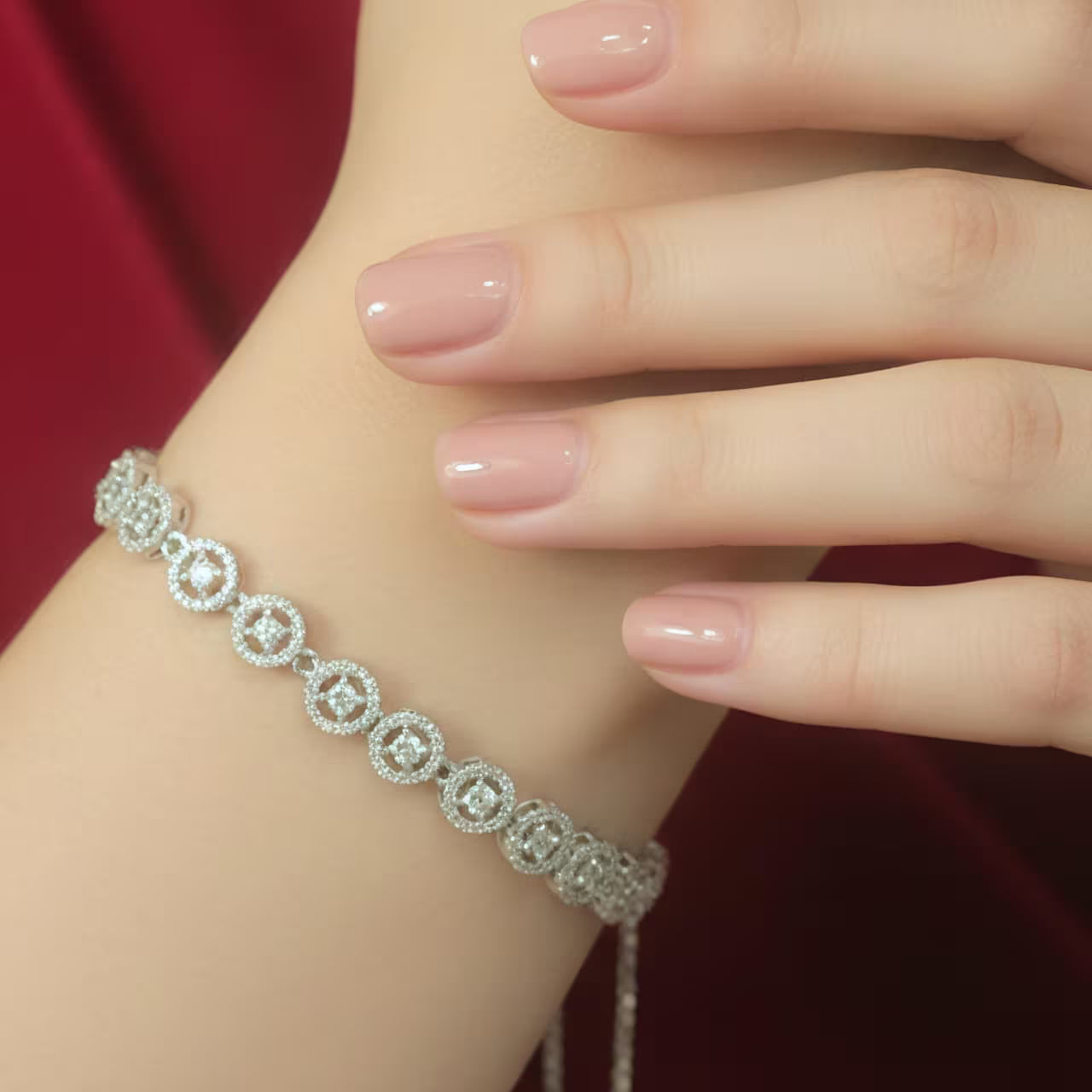 Silver zircon circle bracelet for women worn on hand.