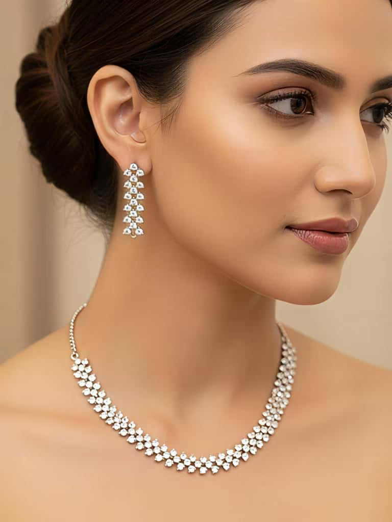 Elegant white floral diamond necklace set with matching earrings worn by model