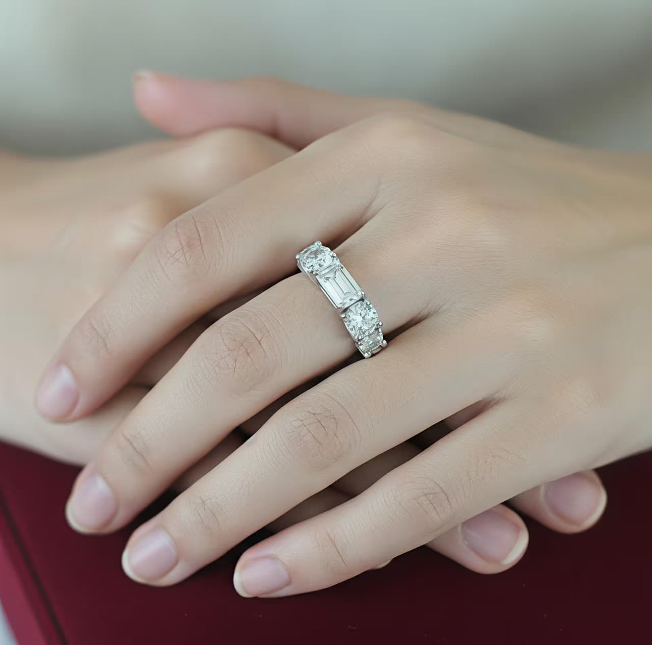 
Silver solitaire ring with emerald-cut white zircon and side stones