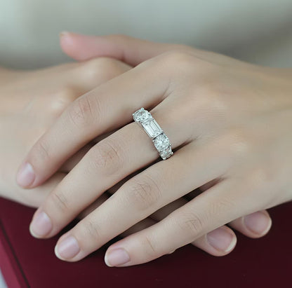 
Silver solitaire ring with emerald-cut white zircon and side stones