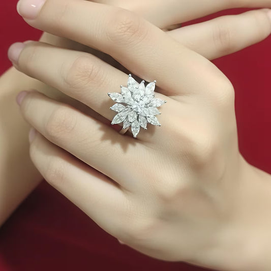 Emerald green cushion cut stone silver ring with floral zircon swirl design.