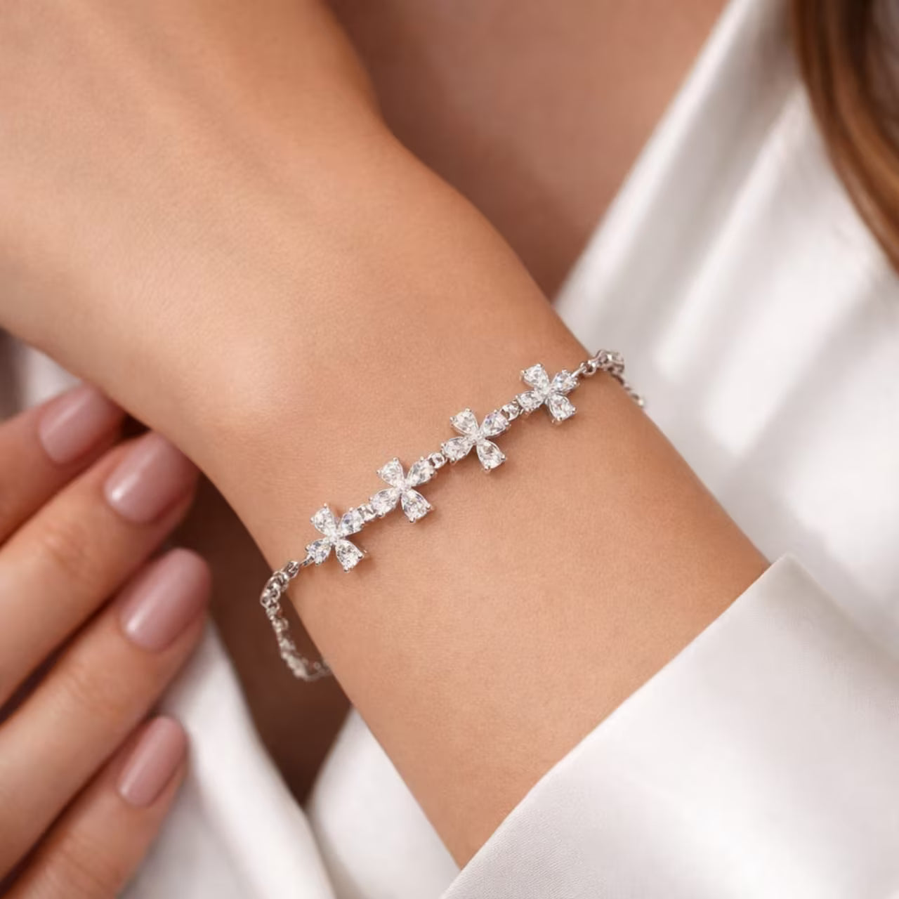 Floral diamond bracelet for women with silver finish worn on hand close-up