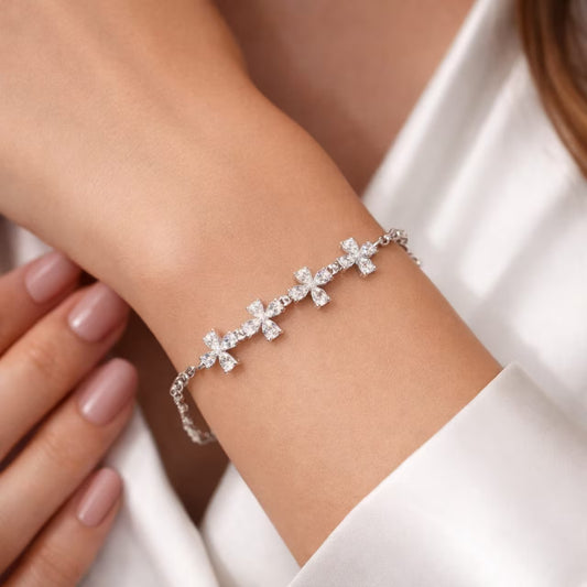 Floral diamond bracelet for women with silver finish worn on hand close-up
