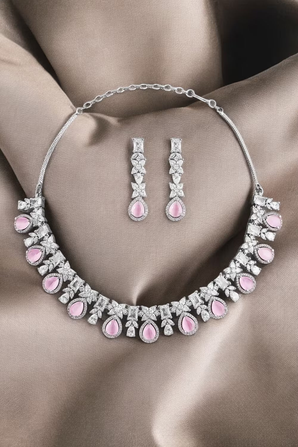 Floral silver zircon necklace set with matching earrings by Karat India.