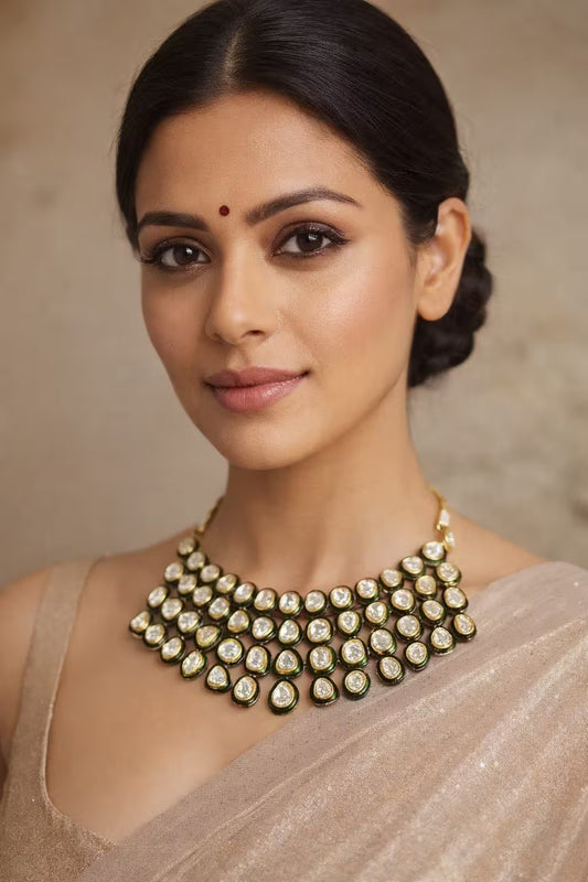Traditional gold tone jadau necklace set with pearl drops and matching earrings