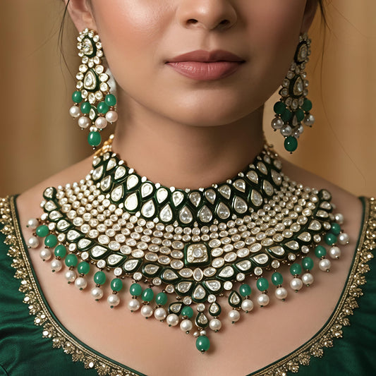 Broad Jadau necklace set with diamond polki stones and pearl border.