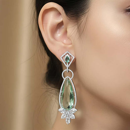 Long emerald silver drop earrings with AAA zirconia stones by Karat India
