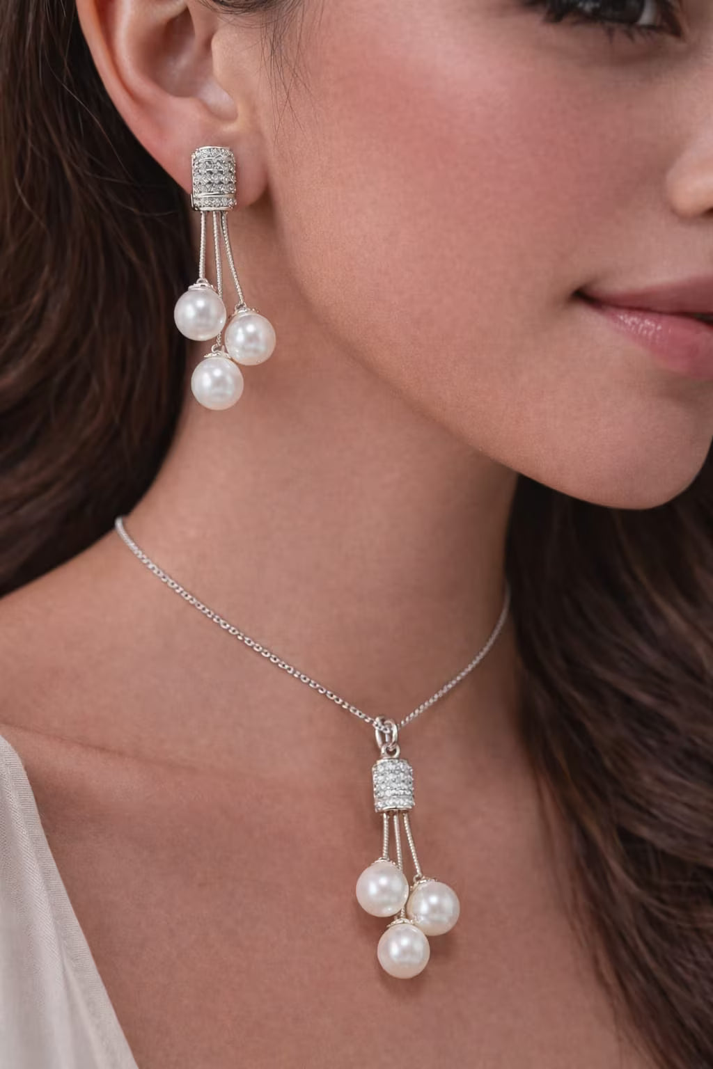 Pearl drop diamond silver pendant set worn by model