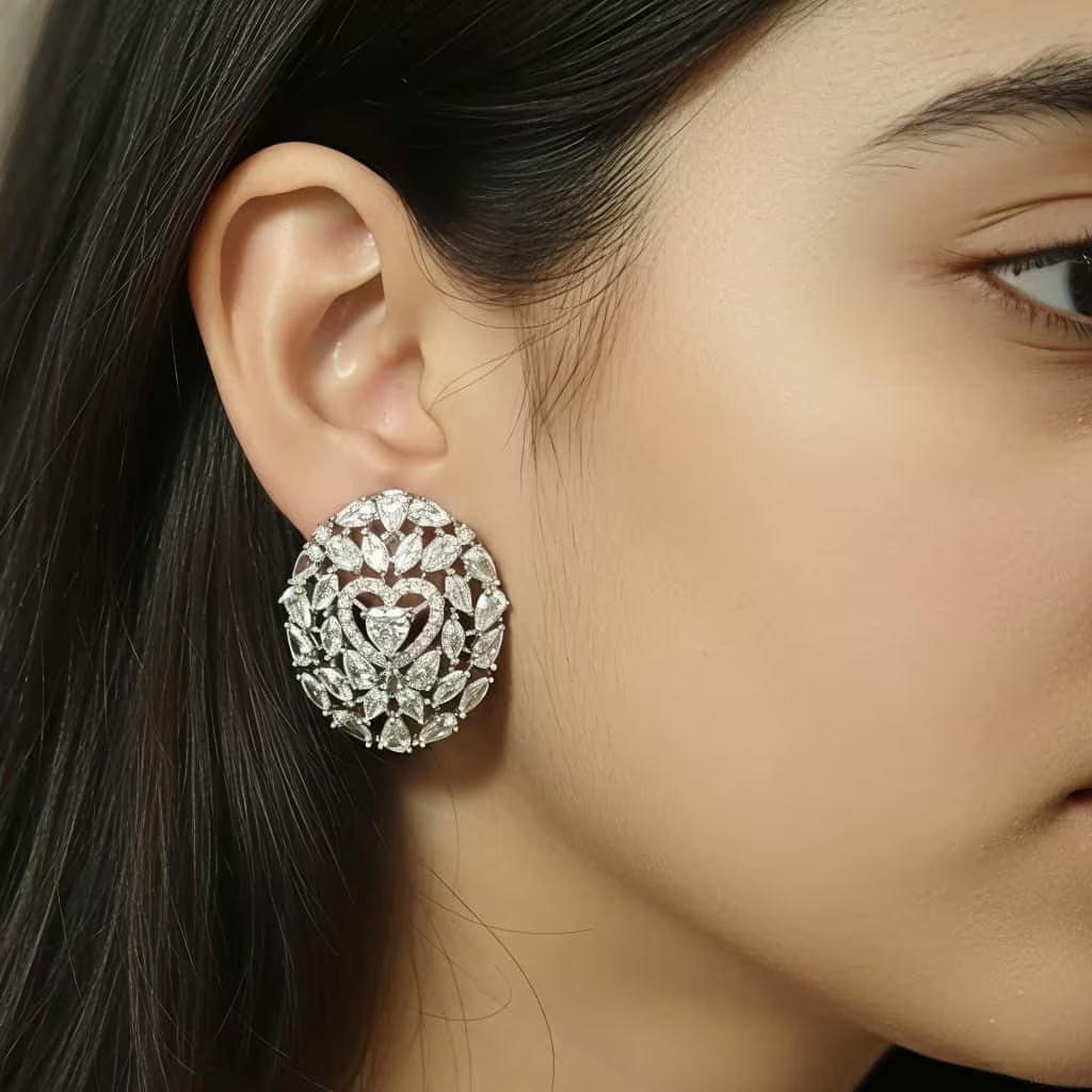 Silver floral stud earrings with zircon stones by Karat India