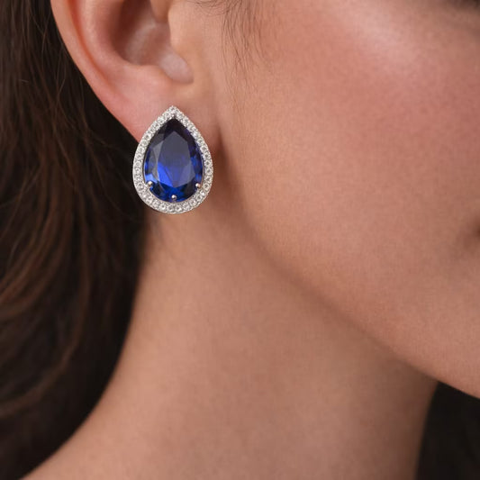 Royal blue teardrop diamond stud earrings with silver finish
