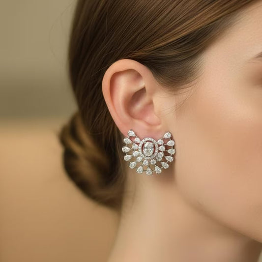 
Royal floral silver stud earrings with AAA zirconia stones by Karat India.
