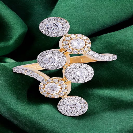 Silver and gold tone cluster ring with round white zircon stones and halo design